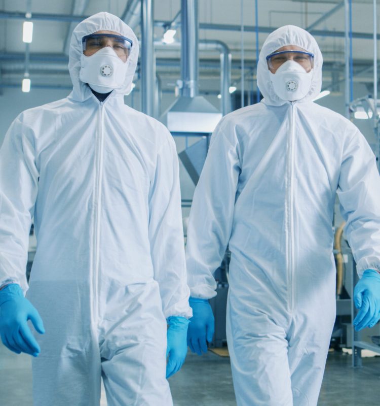 Two,Engineers/,Scientists,In,Hazmat,Sterile,Suits,Walking,Through,Technologically